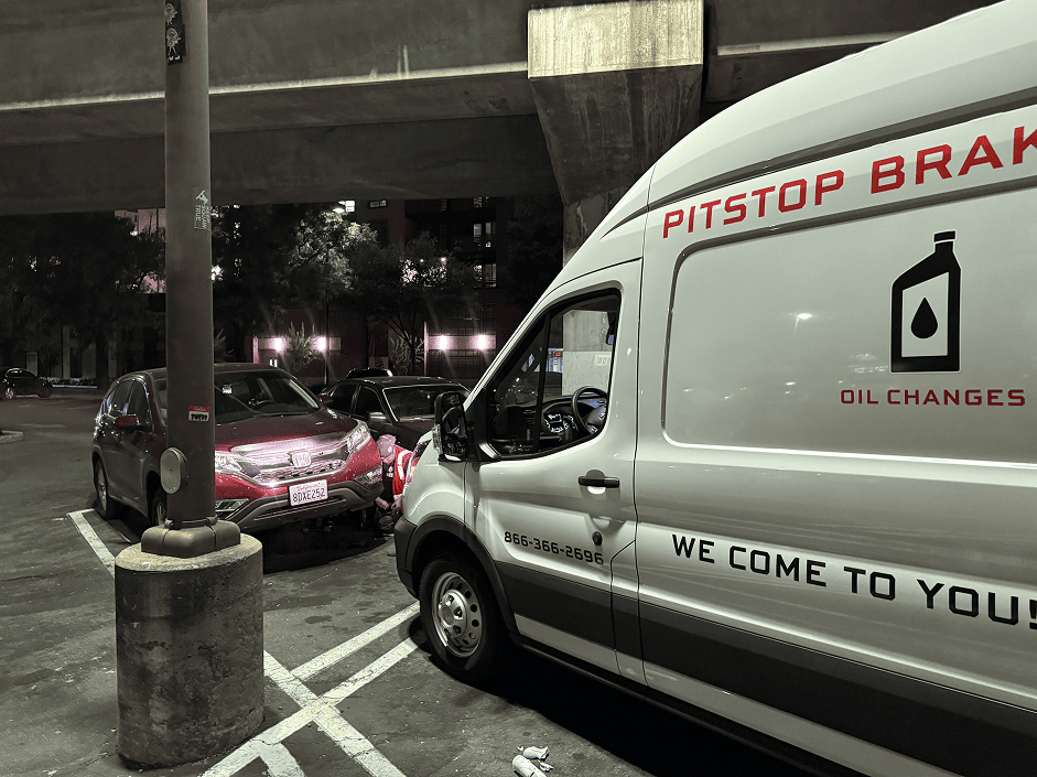 PitStop Mobile Mechanic van parked beside a Honda CR-V during an on-site brake pad and rotor replacement in Concord, California