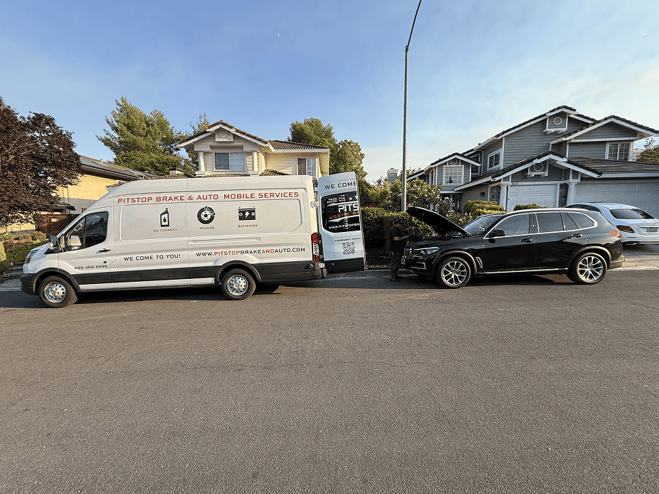 PitStop Mobile Mechanic service van beside a BMW X5 during a full synthetic oil change at a home in Danville, California